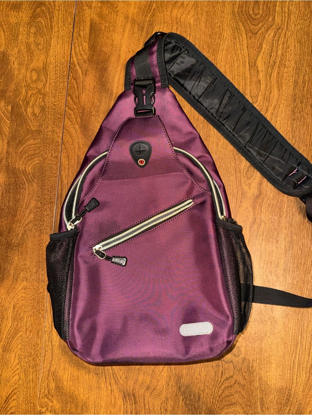 Compact Purple Sling Backpack with Padded Strap